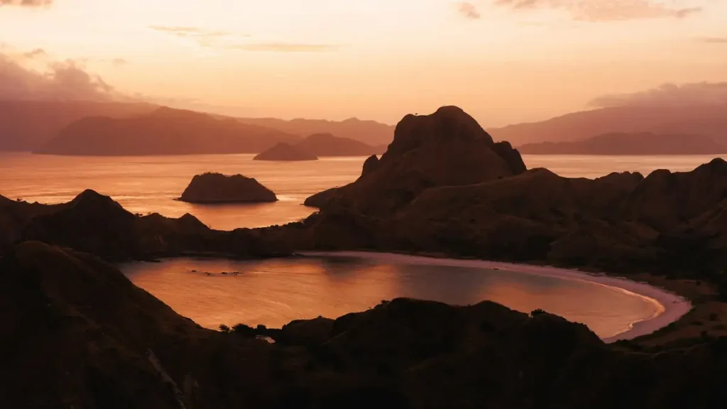 Hills and ocean at sunset in Komodo National Park, seen from the Padar viewpoint